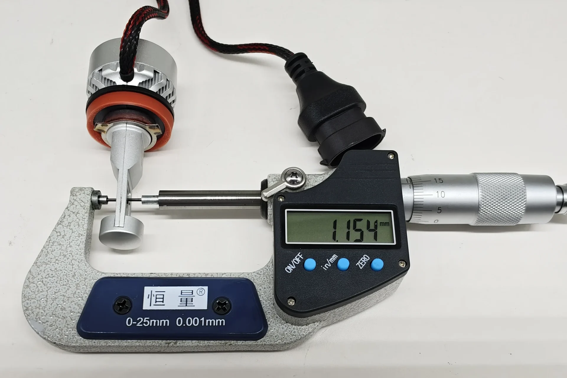 Micrometer measurement of the 1.154 mm separation between opposing EB H11 LEDr emitting surfaces