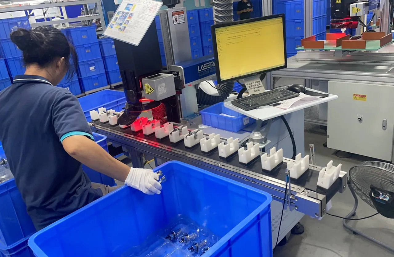 Pre-shipment sample inspection of ECE R37 H11 LEDr bulbs at the factory QC station