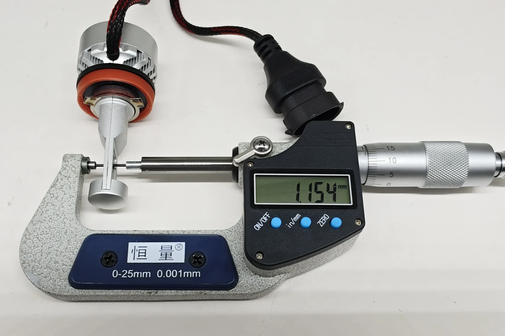 Micrometer measurement of the 1.154 mm distance between opposing EB LED emitting surfaces